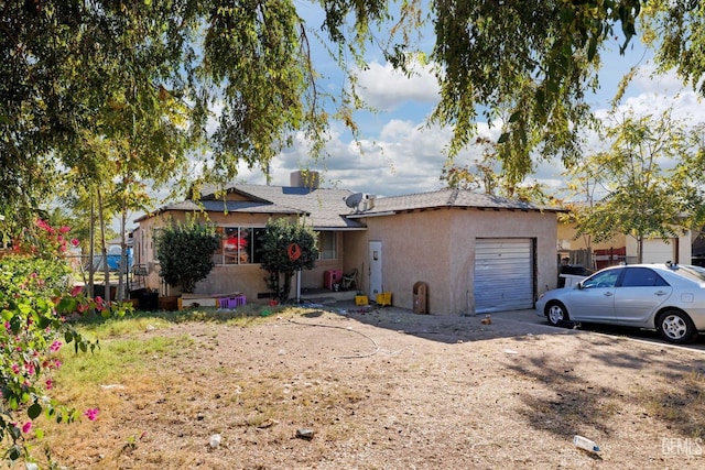 single story home with a garage