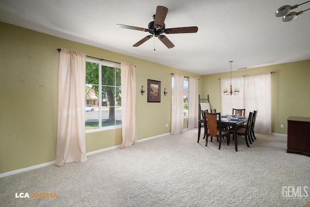 10815 Lewelling St, Bakersfield, CA 93312 - dining space with a chandelier, carpet floors, ceiling fan, baseboards, and a textured ceiling
