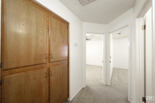 6008 Alderpointe St, Bakersfield, CA 93313 - corridor with light carpet and a textured ceiling