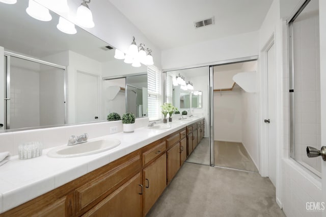 6008 Alderpointe St, Bakersfield, CA 93313 - bathroom with an enclosed shower, double vanity, and a spacious closet