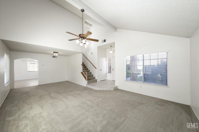 6008 Alderpointe St, Bakersfield, CA 93313 - unfurnished living room with carpet floors, stairway, a ceiling fan, beamed ceiling, and arched walkways