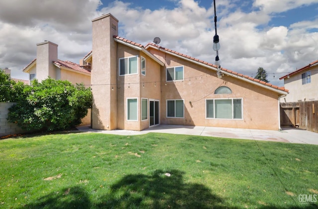 6008 Alderpointe St, Bakersfield, CA 93313 - back of house with a patio area, stucco siding, a chimney, and a tiled roof
