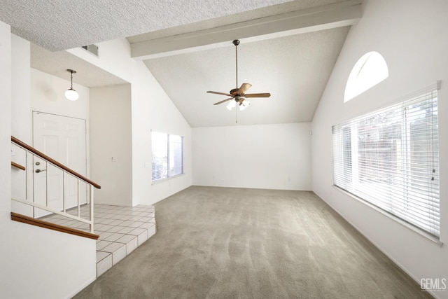 6008 Alderpointe St, Bakersfield, CA 93313 - unfurnished living room with carpet floors, a ceiling fan, beam ceiling, stairs, and high vaulted ceiling