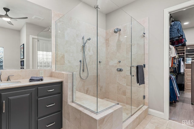 1904 Cricket Park Ct, Bakersfield, CA 93311 - full bath with a stall shower, a spacious closet, ceiling fan, tile patterned flooring, and vanity