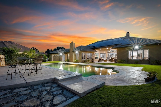 1904 Cricket Park Ct, Bakersfield, CA 93311 - pool at dusk with a patio area, a yard, an outdoor pool, and outdoor lounge area