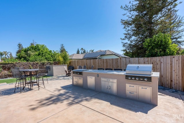 1904 Cricket Park Ct, Bakersfield, CA 93311 - view of patio featuring a grill, area for grilling, a fenced backyard, and outdoor dining space