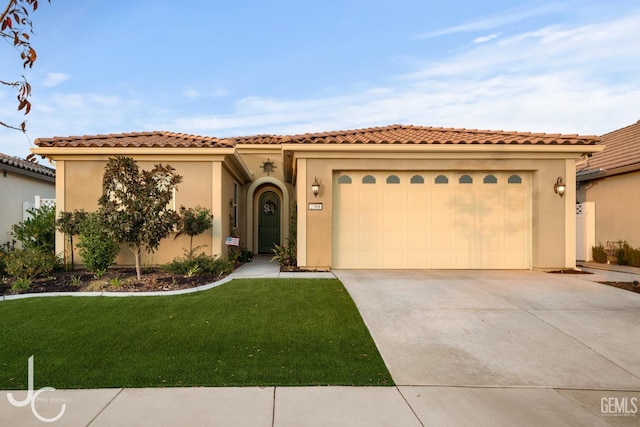 mediterranean / spanish-style house with a front lawn and a garage