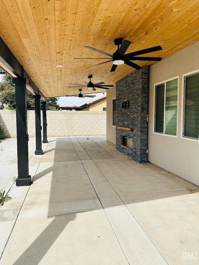 view of patio / terrace with a ceiling fan and fence
