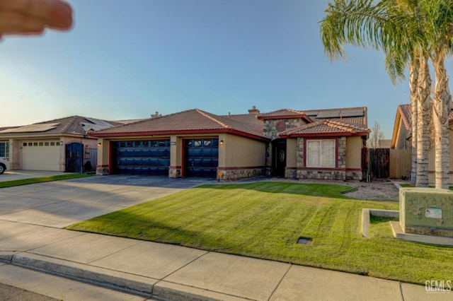 4716 Ambrister Dr, Bakersfield, CA 93313 - view of front of house featuring an attached garage, stucco siding, a tile roof, fence, and driveway