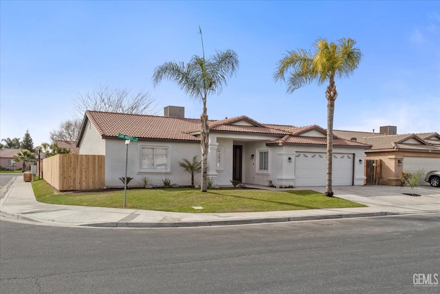 view of front of home with a garage and a front yard