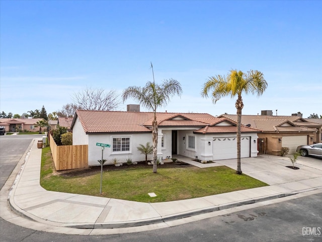 ranch-style home with a garage and a front yard