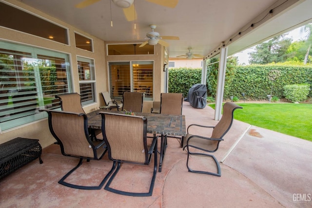 view of patio with outdoor dining area, a grill, and ceiling fan