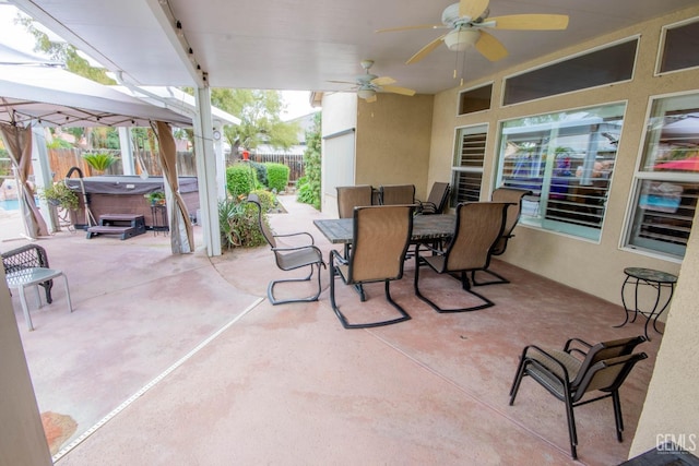 view of patio / terrace featuring outdoor dining space, a ceiling fan, and fence