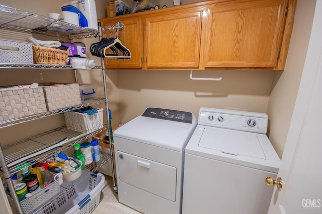 laundry room featuring cabinet space and independent washer and dryer