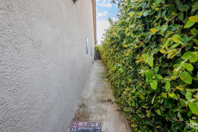 view of side of property featuring stucco siding