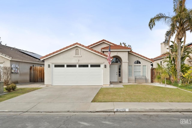 view of front of property with a garage and a front yard