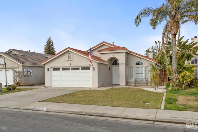 view of front of property featuring a garage and a front lawn