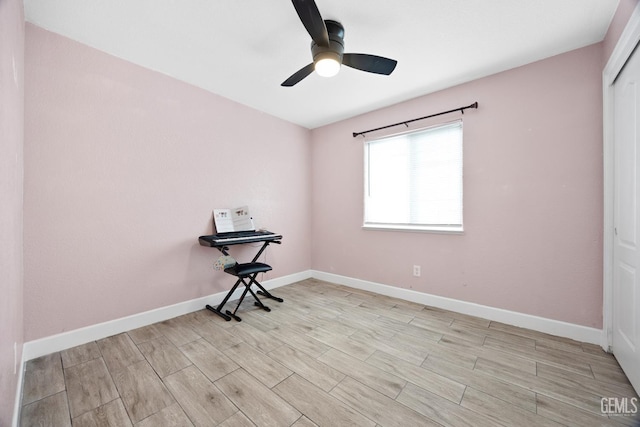 spare room with light hardwood / wood-style floors and ceiling fan