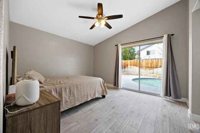 bedroom featuring ceiling fan, light hardwood / wood-style floors, vaulted ceiling, and access to outside