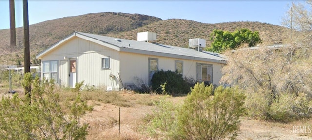 view of property exterior featuring a mountain view