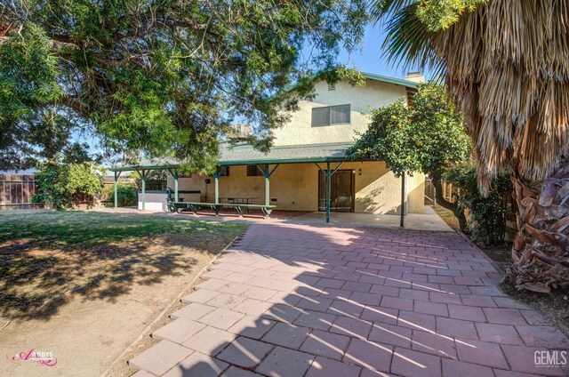 rear view of property with a patio