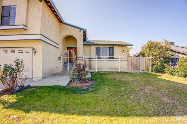 view of front of home with a garage and a front lawn