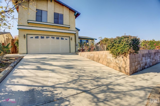 view of front of home with a garage