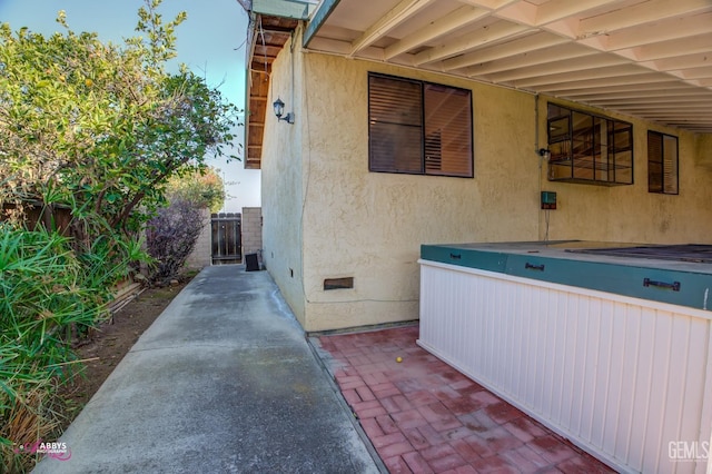 view of side of property featuring a patio