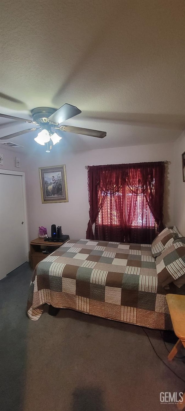 carpeted bedroom with ceiling fan