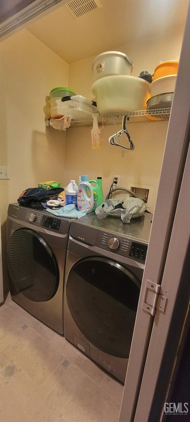 laundry area featuring separate washer and dryer