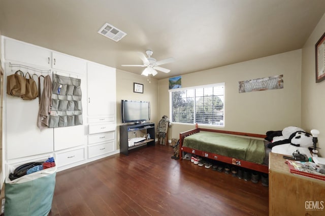 bedroom featuring dark hardwood / wood-style floors and ceiling fan