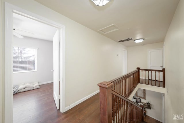 hallway with dark hardwood / wood-style floors