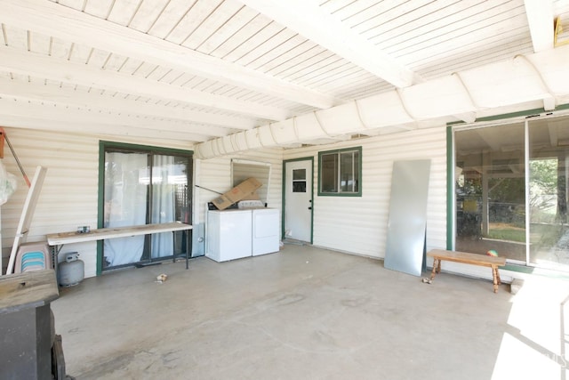view of patio with washing machine and clothes dryer