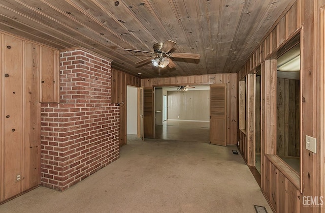 corridor with carpet flooring, wood walls, and wooden ceiling