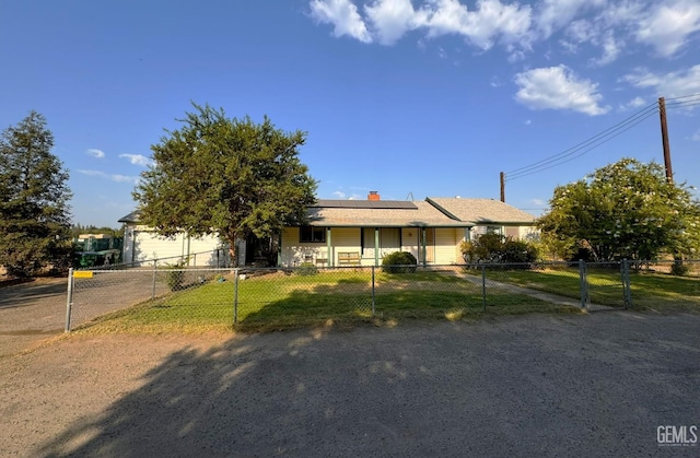 ranch-style home with solar panels