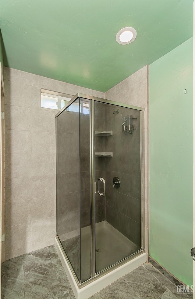 full bathroom with a shower stall