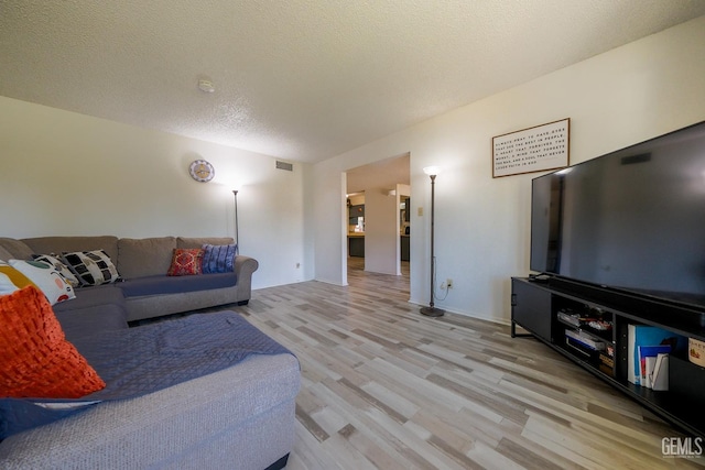 4508 Glengary Pl, Bakersfield, CA 93313 - living room with light wood-type flooring and a textured ceiling