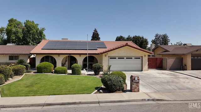 4508 Glengary Pl, Bakersfield, CA 93313 - view of front of property with an attached garage, concrete driveway, a tiled roof, and stucco siding