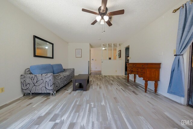 4508 Glengary Pl, Bakersfield, CA 93313 - living area with light wood-type flooring, a ceiling fan, and a textured ceiling