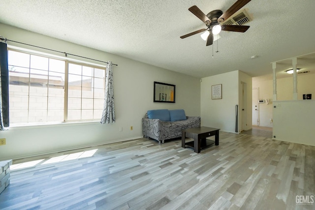 4508 Glengary Pl, Bakersfield, CA 93313 - sitting room featuring a textured ceiling, wood finished floors, and ceiling fan