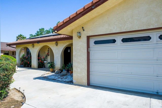 4508 Glengary Pl, Bakersfield, CA 93313 - garage featuring roof mounted solar panels