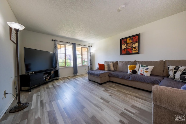 4508 Glengary Pl, Bakersfield, CA 93313 - living area featuring a textured ceiling, wood finished floors, and baseboards