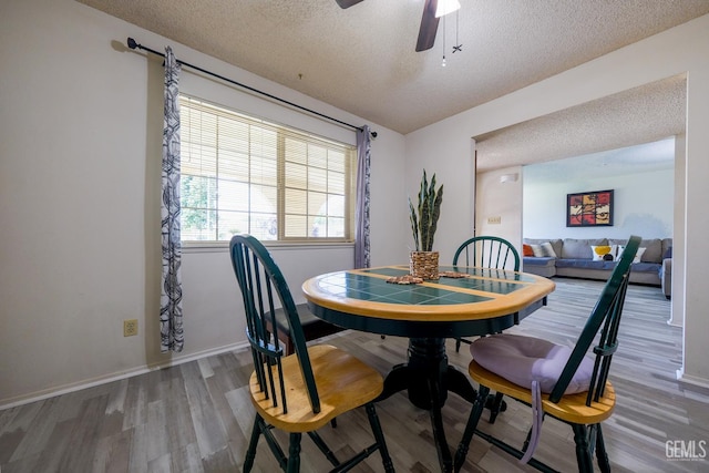 4508 Glengary Pl, Bakersfield, CA 93313 - dining room featuring a textured ceiling, wood finished floors, ceiling fan, and baseboards