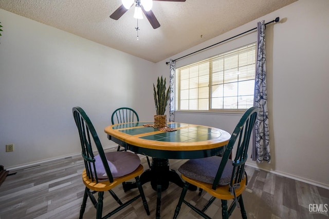 4508 Glengary Pl, Bakersfield, CA 93313 - dining area featuring a textured ceiling, ceiling fan, wood finished floors, and baseboards
