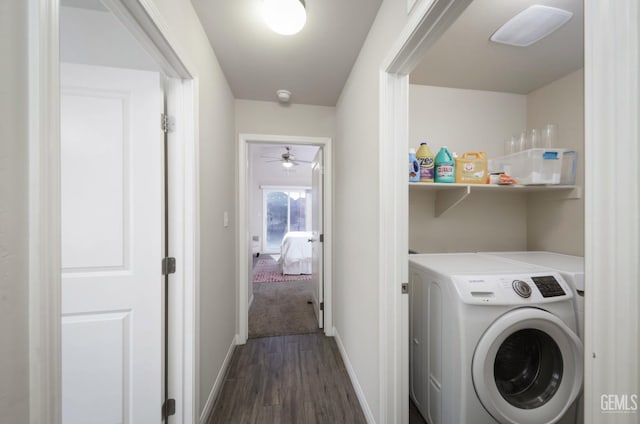 laundry room featuring washer / clothes dryer, baseboards, dark wood-style flooring, and laundry area