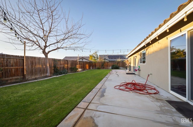 view of yard featuring a patio and a fenced backyard