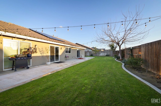 view of yard with a fenced backyard and a patio