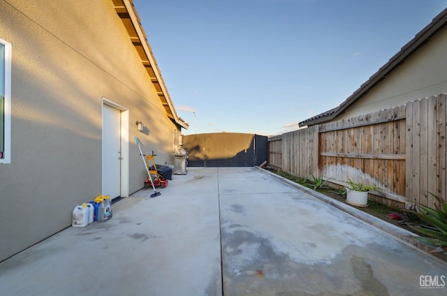 view of patio featuring fence