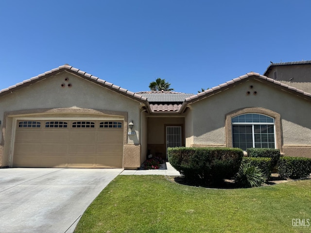 11908 Nebula Ct, Bakersfield, CA 93312 - mediterranean / spanish house featuring a tiled roof, stucco siding, an attached garage, solar panels, and a front lawn