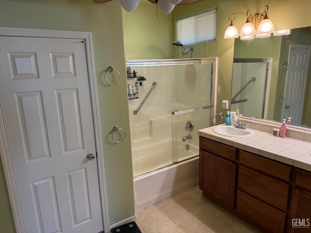 11908 Nebula Ct, Bakersfield, CA 93312 - bathroom with bath / shower combo with glass door, vanity, and ceiling fan